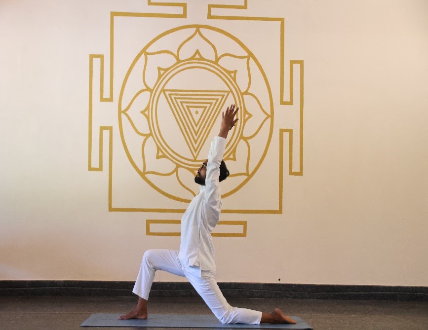 practicing Surya Namaskar yoga sequence at sunrise, showcasing the healing benefits for physical fitness, mental clarity, and spiritual well-being